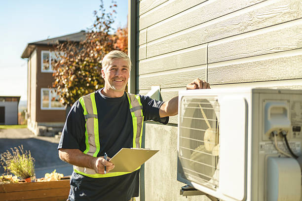 istock Technician working on air conditioning or heat pump outdoor unit 2243032903
