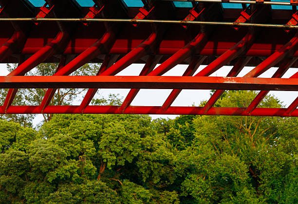 Close-up of red and black industrial machine part with geometric patterns