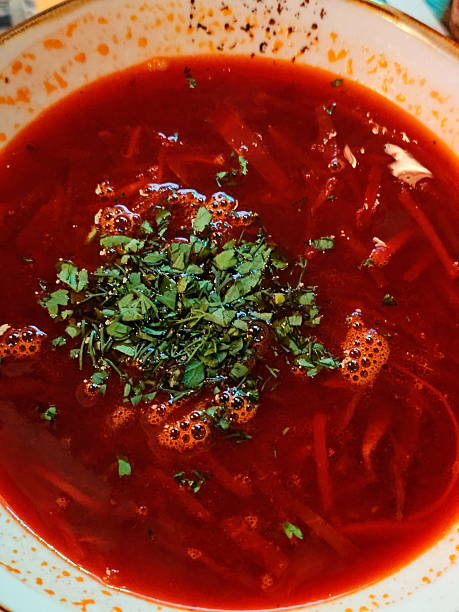 istock Still life with borscht and sour cream on a wooden table 2243040721