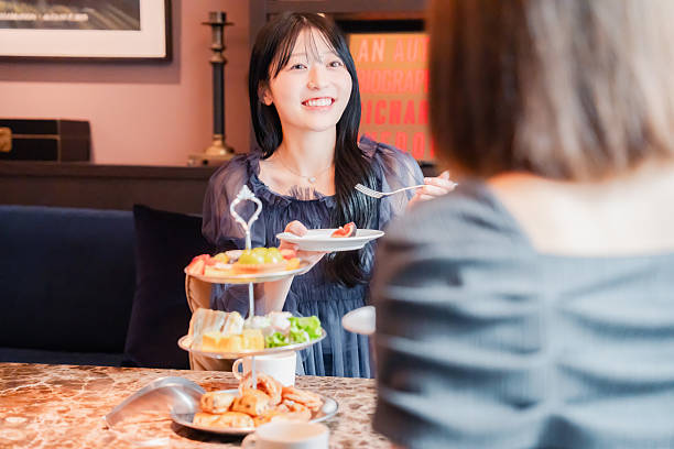 istock Two young women enjoying afternoon tea at a hotel 2243045387