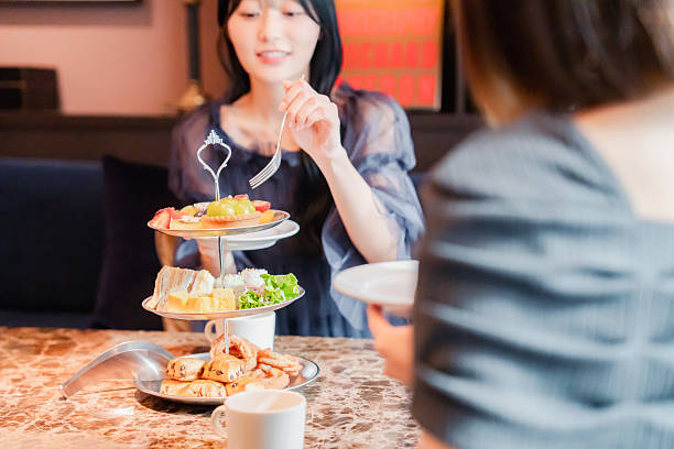 istock Two young women enjoying afternoon tea at a hotel 2243045894