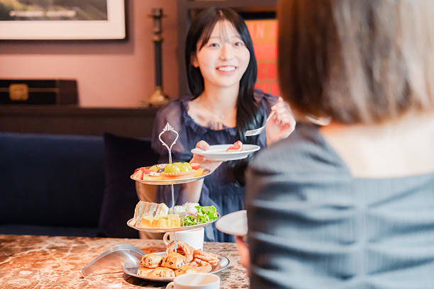 istock Two young women enjoying afternoon tea at a hotel 2243045904