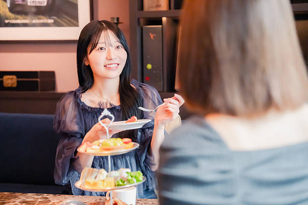 istock Two young women enjoying afternoon tea at a hotel 2243045909