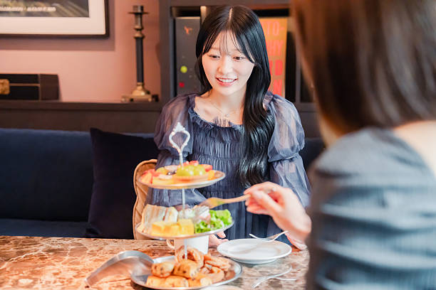 istock Two young women enjoying afternoon tea at a hotel 2243045912