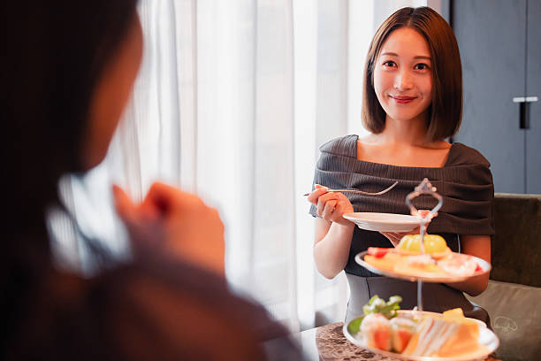 istock Two young women enjoying afternoon tea at a hotel 2243045926