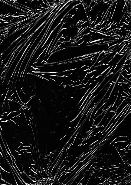 istock Polyethylene texture with deep wrinkles and smooth highlights, glossy plastic surface close-up, realistic macro detail for abstract or packaging concept. 2243049723
