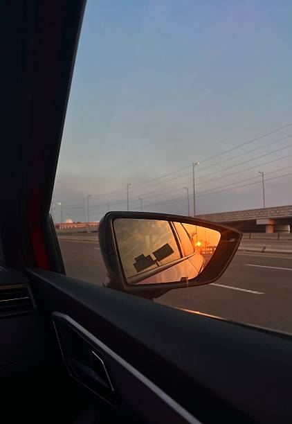 istock Sunset Reflection in Car Side Mirror on the Highway 2243050873