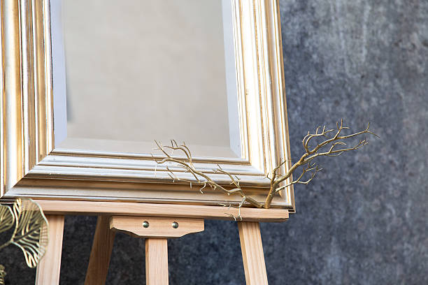 istock antique frame setup, vintage gilded frame displayed against textured stone background with dried 2243055503