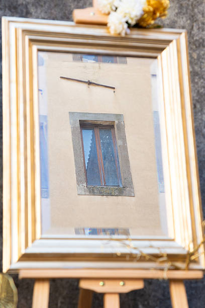 istock reflective antique mirror, antique goldframed mirror reflecting aged cityscape and rustic charm 2243057703