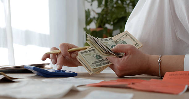istock Household budget audit with cash and receipts 2243061153
