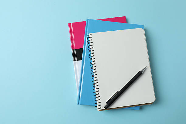 istock laptop glasses coffee headphones notepad on a blue background with space for text 2243062471