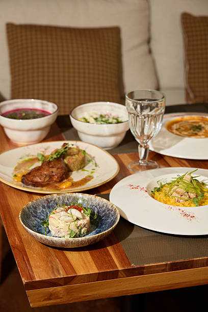 istock An Array of Assorted Gourmet Dishes Beautifully Arranged on a Charming Wooden Table Setting 2243064067