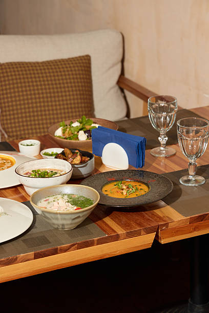 istock A Delicious Array of Colorful Dishes Displayed Beautifully on a Wooden Table Setting 2243064280