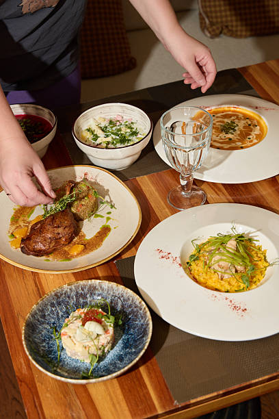 istock A gourmet dinner table setting with diverse dishes and elegant presentation to delight the senses 2243065435