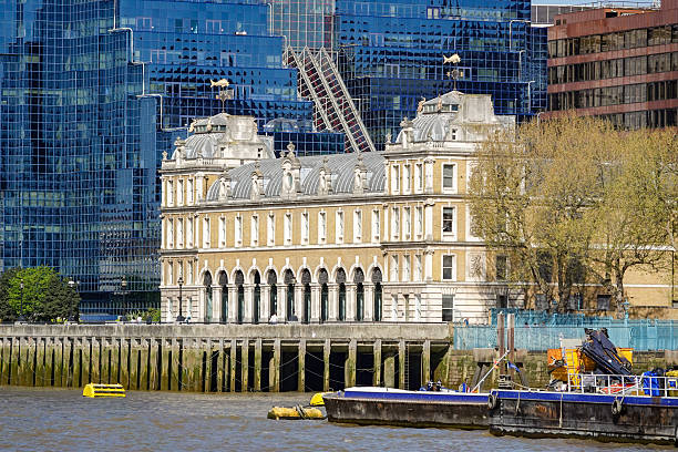 London, England, UK –29 July 2025: Chelsea Embankment urban view towards Chelsea Bridge and the Nine Elms district skyline, with riverside trees along the River Thames in South London, UK. Skyscrapers of the Vauxhall and Nine Elms area rise across the river in the background.
