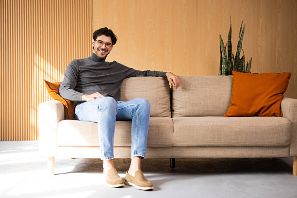 istock Man wearing turtleneck relaxing on modern sofa 2243083035