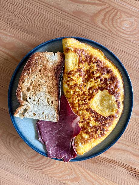 istock Homemade Stuffed omelette with bacon and sourdough bread slice 2243083191