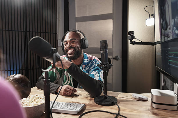 istock Young black man hosting university students podcast online 2243088881