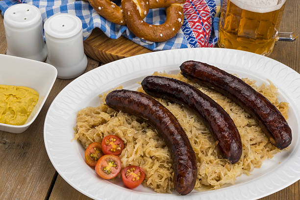 istock Smoked pork sausages with sauerkraut 2243095958
