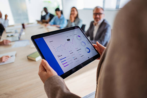 istock Business Meeting With Tablet Analytics In Modern Conference Room With Team 2243098234
