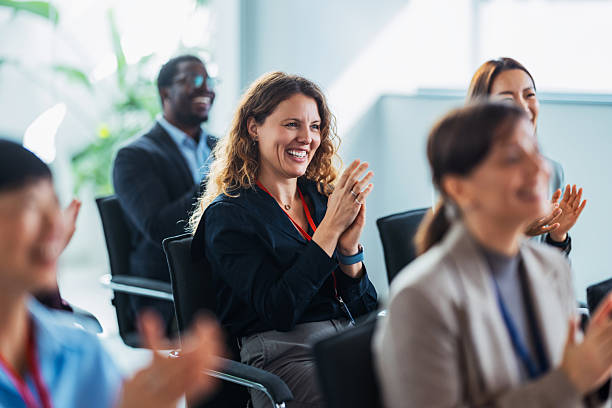 istock Happy Team Clapping and Smiling During Office Meeting With Diverse Colleagues Celebrating Success 2243098257