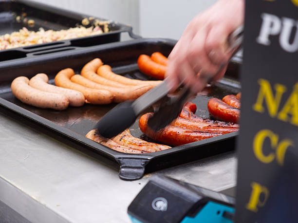 Cooking sausages on electric griddle pan