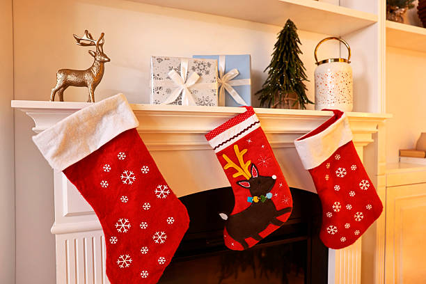 istock Fireplace with stockings and Christmas decor indoors 2243100938