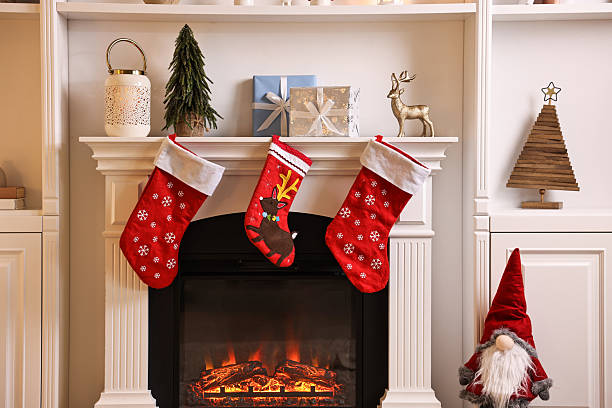 istock Fireplace with stockings and Christmas decor indoors 2243100939