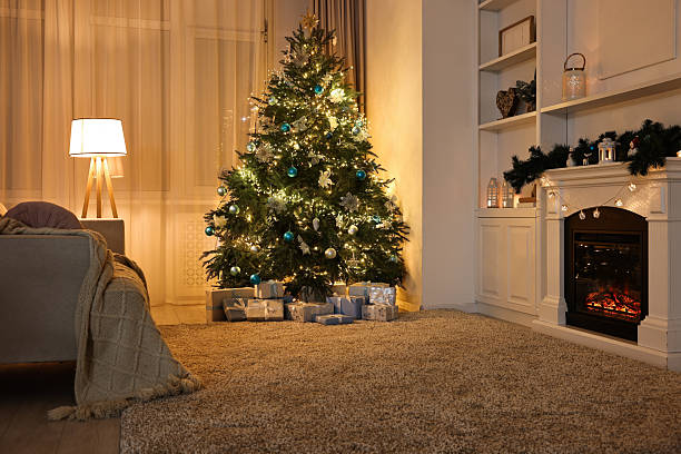istock Christmas tree and decorated fireplace in room. Festive interior 2243100943