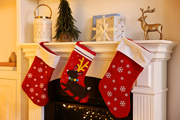 istock Fireplace with stockings and Christmas decor indoors 2243100946