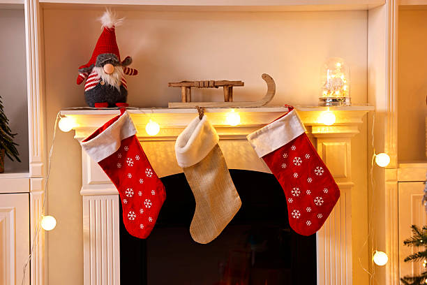 istock Fireplace with stockings and Christmas decor indoors 2243100948