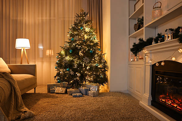 istock Christmas tree and decorated fireplace in room. Festive interior 2243100960