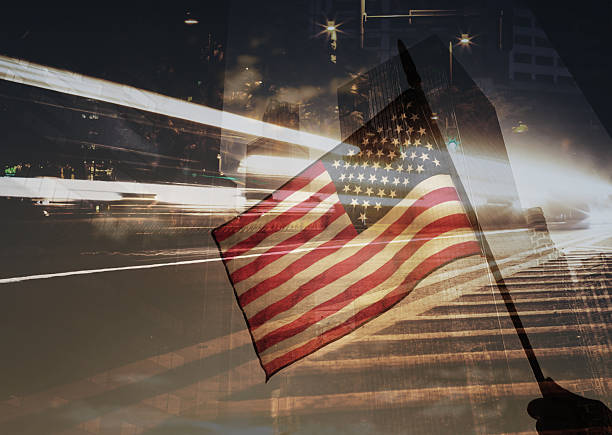 American flag on city background.