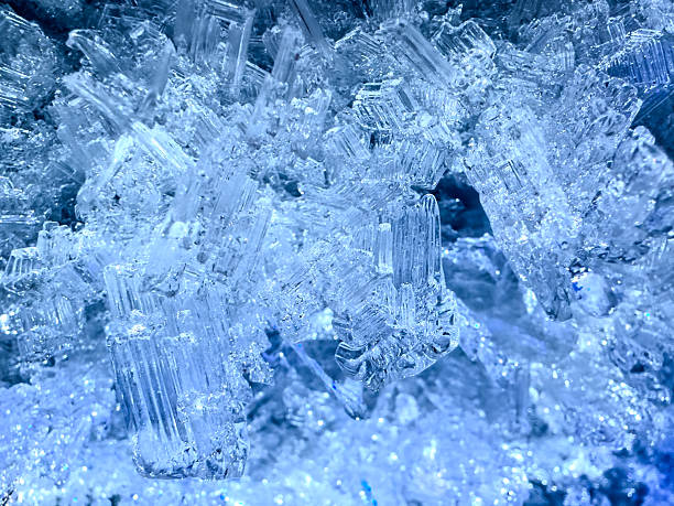 Smooth clear ice in cave with blue colors and tones.