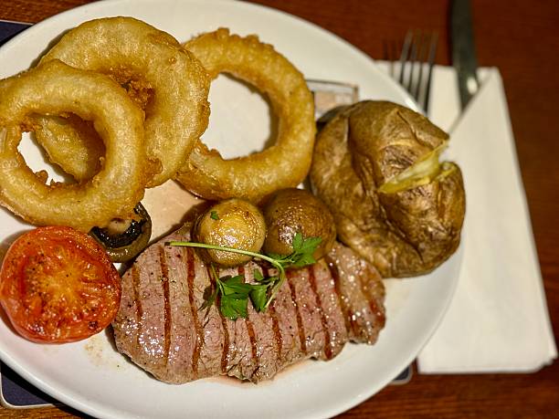 Sirloin steak with fried onion rings in Scotland