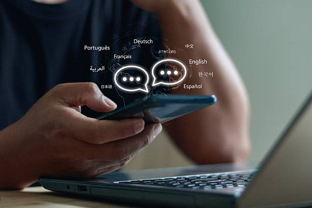 Person holding a smartphone with floating multilingual chat icons, symbolizing AI-powered translation and global communication in various languages like English, Spanish, Chinese and more.