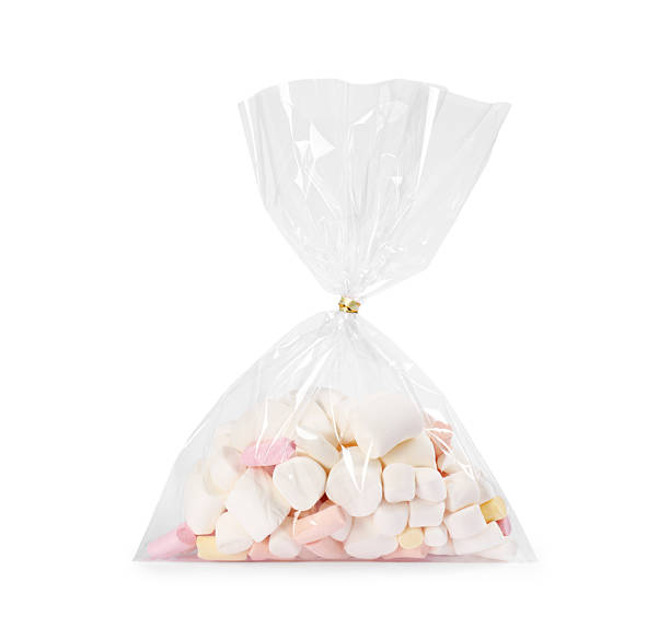istock Plastic bag with marshmallows isolated on white 2243111358