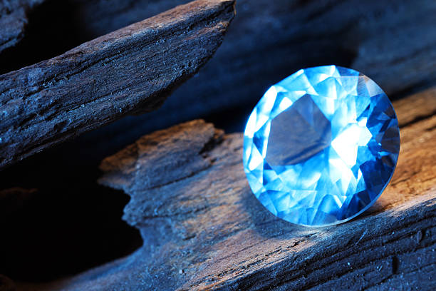 istock Beautiful shiny light blue gemstone on stone, closeup 2243112269