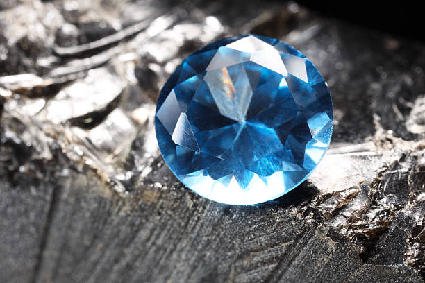 istock Beautiful shiny light blue gemstone on stone, closeup 2243112360
