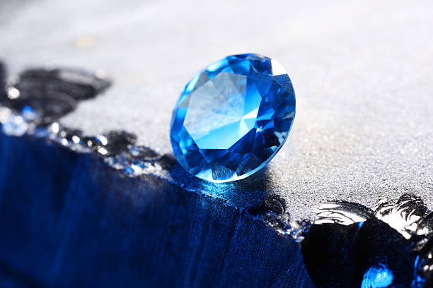 istock Beautiful shiny light blue gemstone on stone, closeup 2243112363