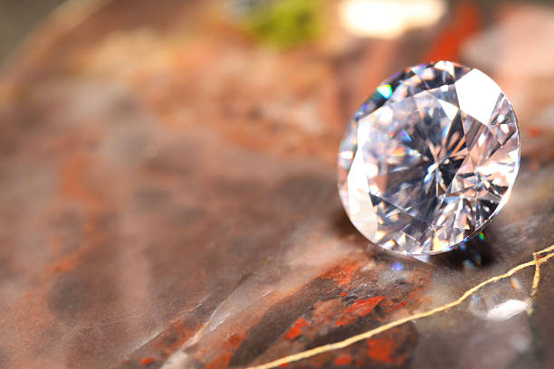 A collection of sparkling diamonds rests on a digital screen with growth chart. The high-polish gems capture prism colors, conveying luxury and elegance, depicting concepts of luxury, wealth and financial growth