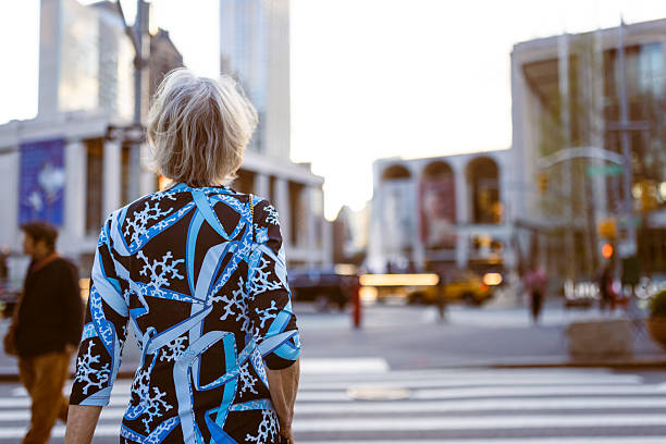 istock City Life: Senior Woman Waiting at Crosswalk 2243112766
