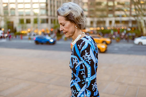 istock Stylish Elderly Woman Strolling in City 2243112817