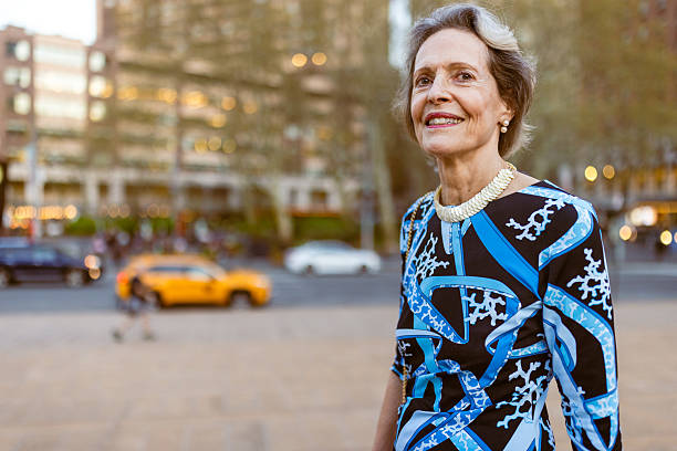 istock Graceful Elderly Woman Smiling Outdoors 2243112822