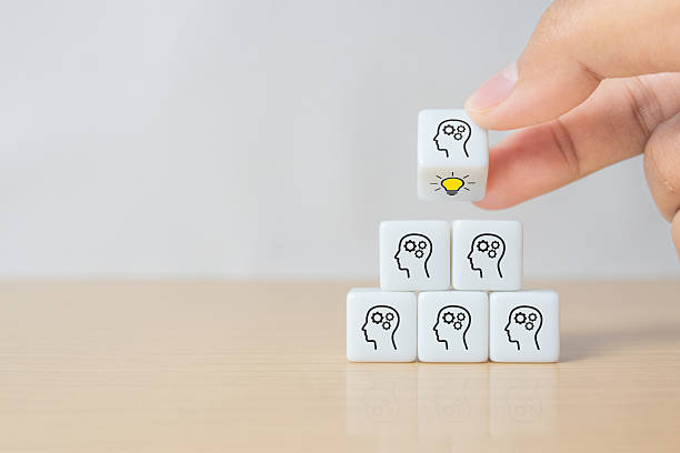 istock Concept creative idea and innovation. Hand flip over dice with head human symbol and light bulb icon 2243115652