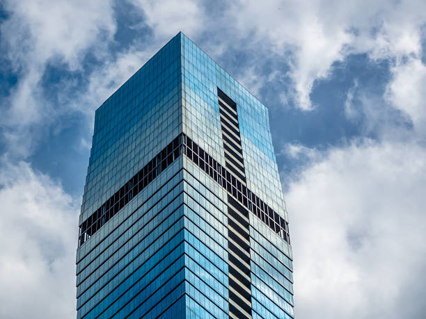 Chicago, Illinois, USA. Oct 24, 2025. The towering St. Regis Chicago skyscraper, a striking example of modern architecture, reaching into a blue sky with clouds.