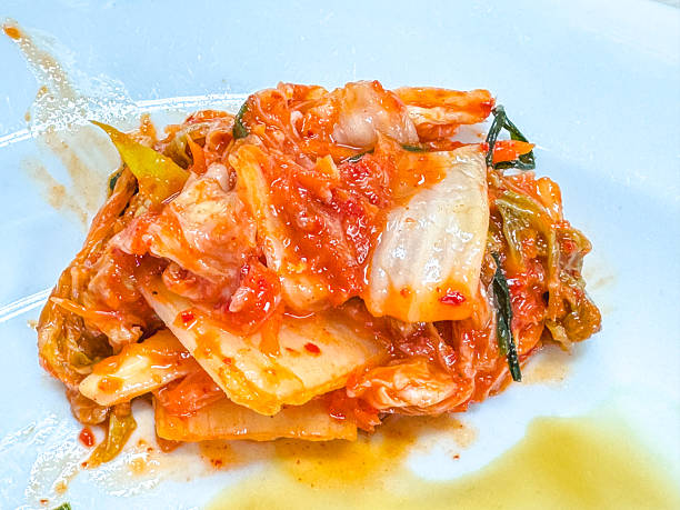 istock Fresh Napa Cabbage Kimchi on White Plate - Korean Fermented Side Dish 2243127038