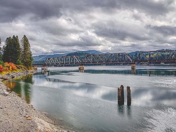 istock Steel bridge over the calm river. 2243127973