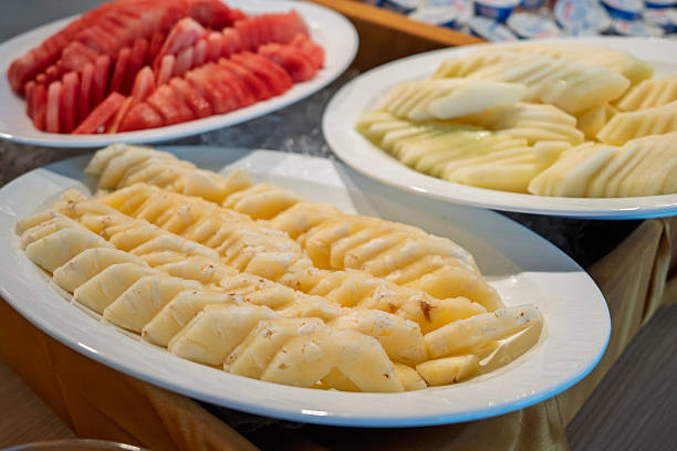 Freshly Sliced Pineapple and Watermelon on Buffet Table