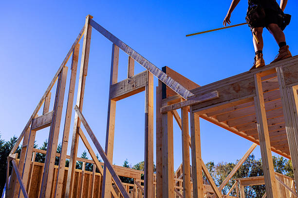 istock Building new home structure with wooden frames beams 2243130076